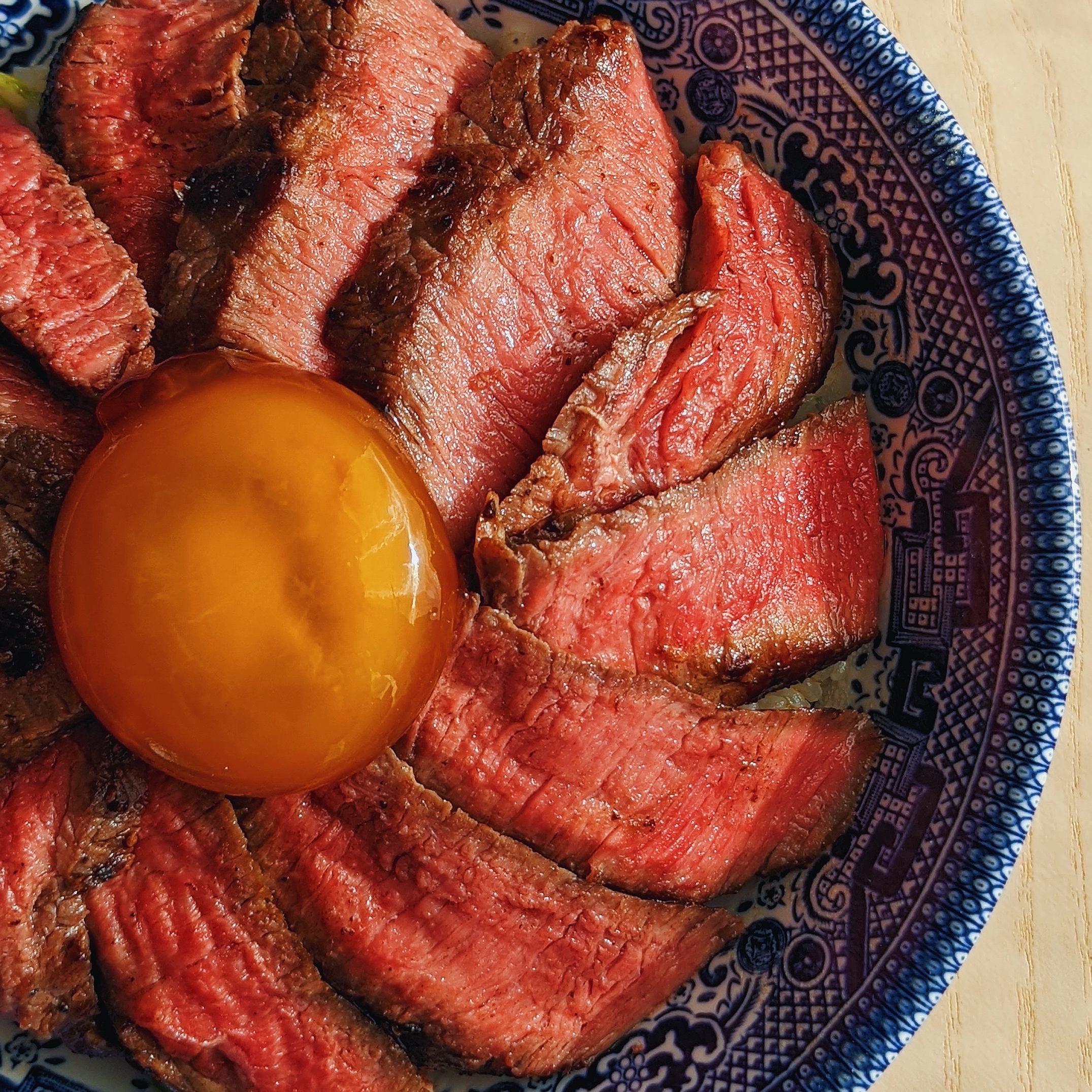 steak butter rice with soy cured egg yolk (牛排蓋飯)